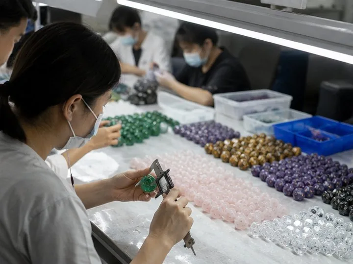 CuiShen quality team measuring and sorting finished gemstone dice