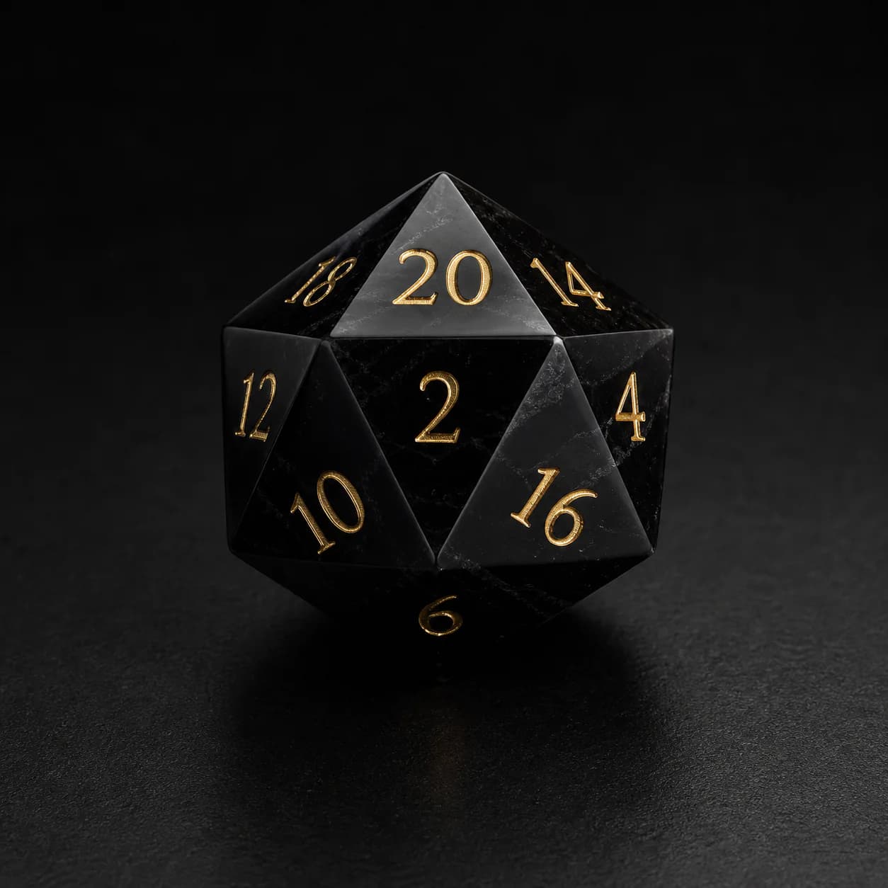 Black obsidian gemstone D20 with engraved gold details